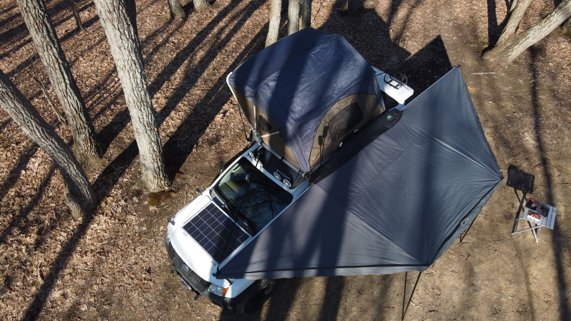 2005 Nissan Xterra with overlanding tent and awnings extended