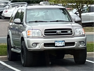 2002 Toyota Sequoia with 16x8 Matte Black DX4 Rebel Wheels, 285/75R16 Falken WildPeak AT3W tires, and Suspension Lift 2.5" Supreme Suspensions Suspension Lifts.