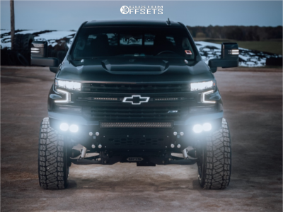 2021 Chevrolet Silverado 1500 with 24x12 Polished ARKON FORGED Splicer Wheels, 35/12.5R24 Kelfire Dmr Rt tires, and Suspension Lift 6" Bds Suspension Lift Kits.