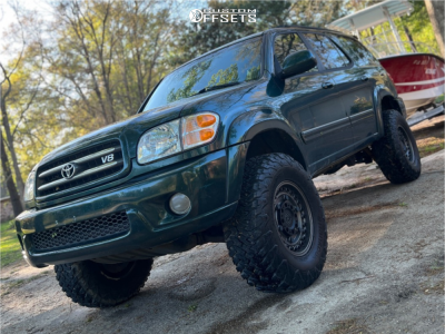 2002 Toyota Sequoia with 17x9.5 Black Black Rhino Armory Wheels, 315/70R17 Hankook Dynapro Mt2 tires, and Suspension Lift 4" Old Man Emu.