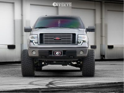 2011 Ford F-150 with 24x14 Black Milled ARKON OFF-ROAD Caesar Wheels, 36/14.5R24 Versatyre MXT tires, and Suspension Lift 6" Zone Lift Kits.