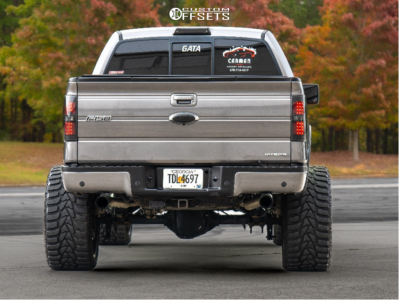 2011 Ford F-150 with 24x14 Black Milled ARKON OFF-ROAD Caesar Wheels, 36/14.5R24 Versatyre MXT tires, and Suspension Lift 6" Zone Lift Kits.