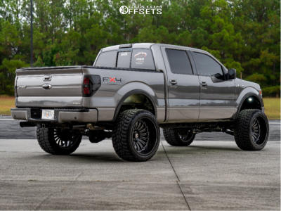 2011 Ford F-150 with 24x14 Black Milled ARKON OFF-ROAD Caesar Wheels, 36/14.5R24 Versatyre MXT tires, and Suspension Lift 6" Zone Lift Kits.