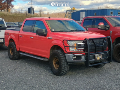 2019 Ford F-150 with 17x8.5 Bronze Method MR305 Wheels, 35/12.5R17 Gladiator X Comp MT tires, and Leveling Kit Rough Country Leveling Kits.