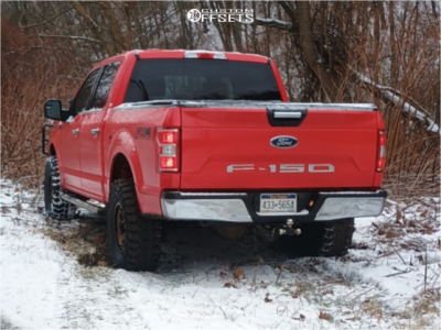 2019 Ford F-150 with 17x8.5 Bronze Method MR305 Wheels, 35/12.5R17 Gladiator X Comp MT tires, and Leveling Kit Rough Country Leveling Kits.