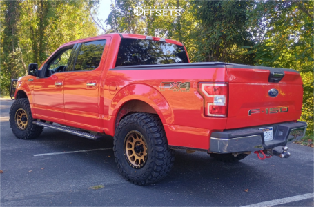 2019 Ford F-150 with 17x8.5 Bronze Method MR305 Wheels, 35/12.5R17 Gladiator X Comp MT tires, and Leveling Kit Rough Country Leveling Kits.