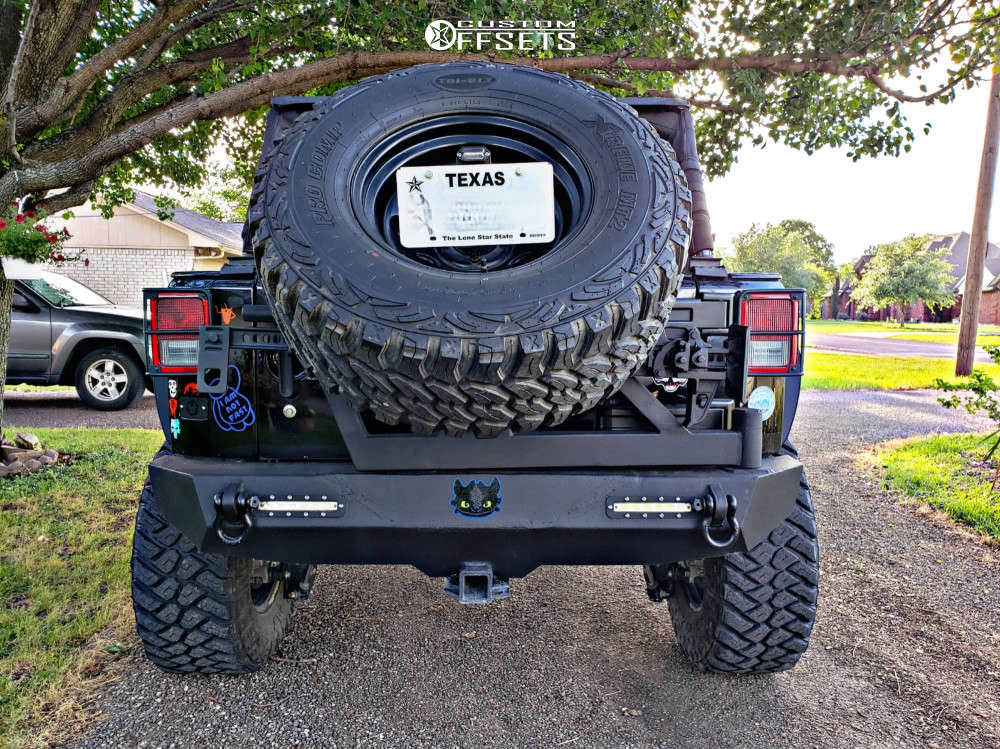 2015 Jeep Wrangler JK with 17x8 6 Pro Comp Series 98 and 35/12.5R17