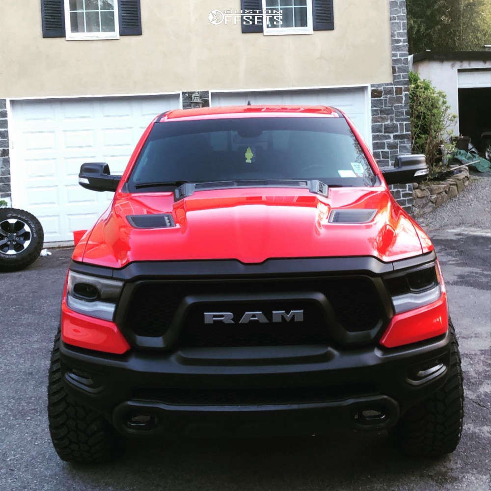 2019 Ram 1500 with 20x12 51 Vision Bomb and 35/12.5R20 AMP Mud Terrain