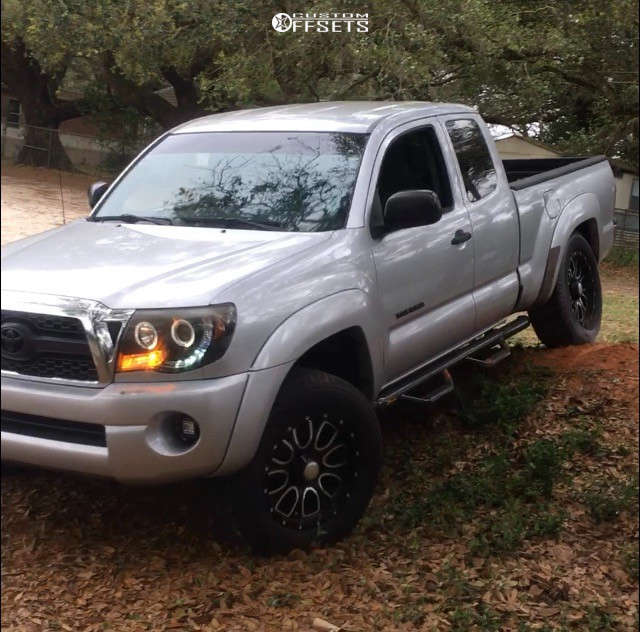 2011 Toyota Tacoma with 18x9 -12 Helo He879 and 265/65R18 Michelin ...
