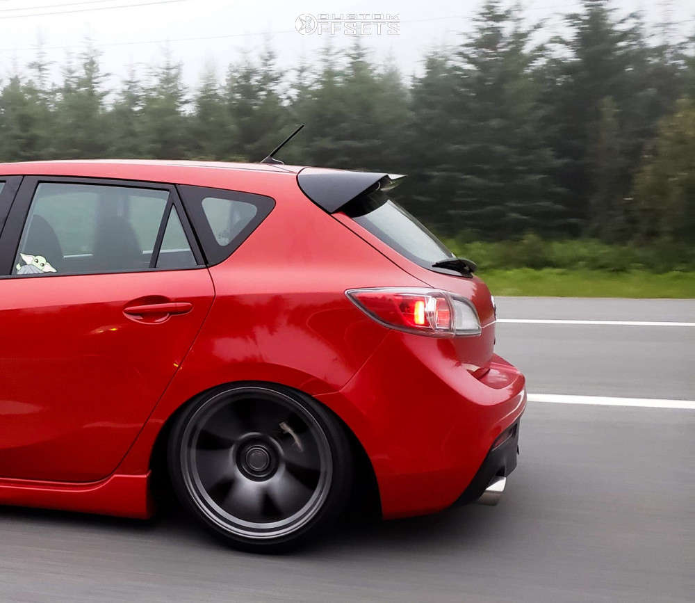 2012 Mazda 3 with 18x9.5 22 Kansei Tandem and 215/40R18 Falken