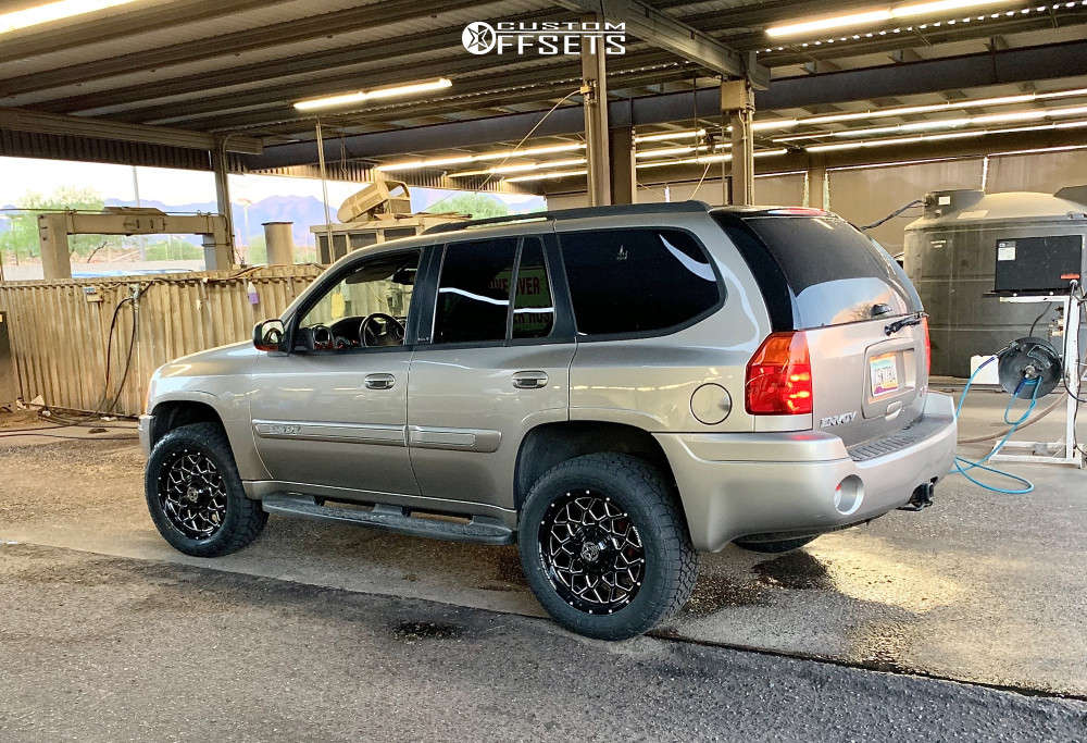 2003 GMC Envoy with 20x9 0 Anthem OffRoad Avenger and 32/10.5R20 Toyo