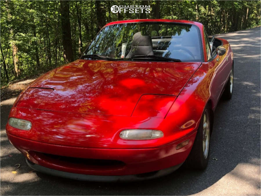 1991 Mazda MX-5 Miata with 15x7 22 Panasport Classic and 205/50R15