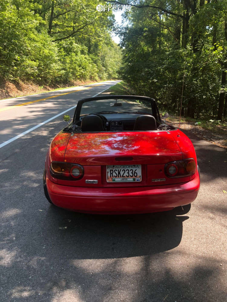 1991 Mazda MX-5 Miata with 15x7 22 Panasport Classic and 205/50R15