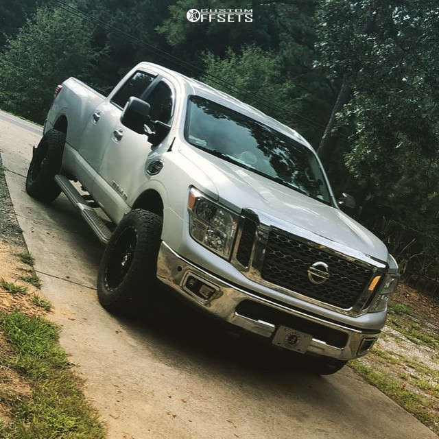 2017 Nissan Titan XD with 20x10 -25 TIS 544BM and 33/12.5R20 Nitto