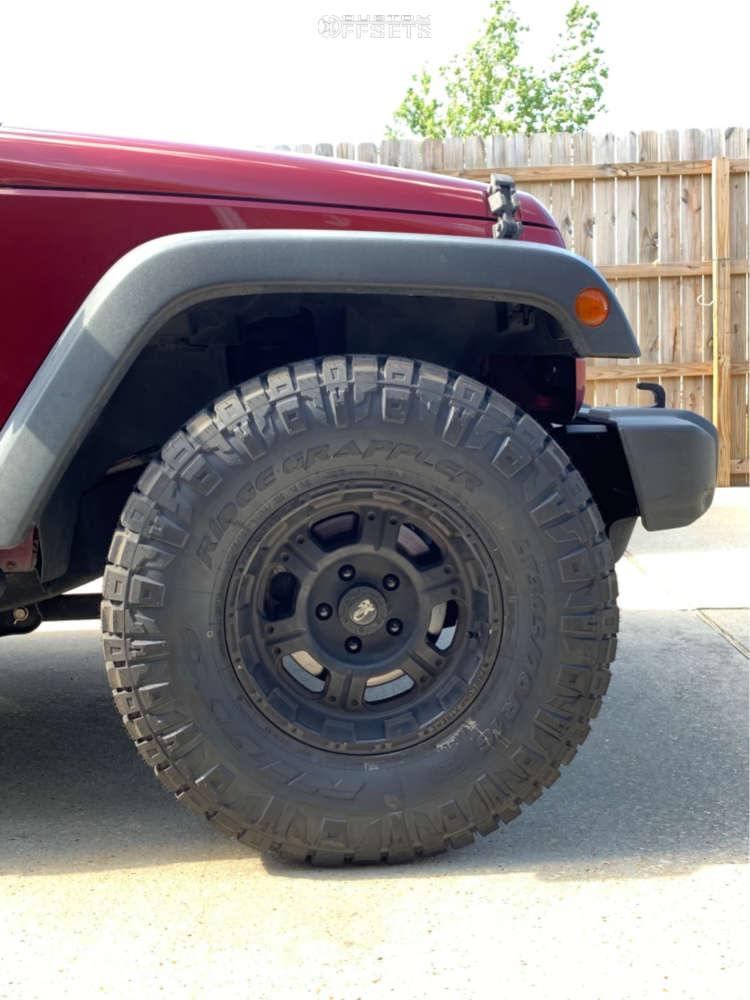 2012 Jeep Wrangler with 16x8 12 Pro Comp XTREME and 305/70R16 