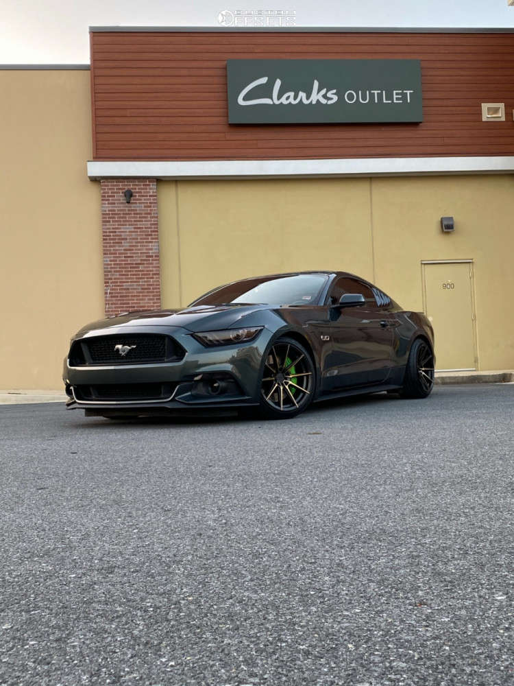 2015 Ford Mustang with 18x9.5 20 XXR 567 and 225/40R18 Milestar