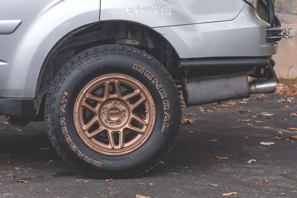 2010 Subaru Forester with 15x7 10 KMC Km716 and 215/75R15 General ...