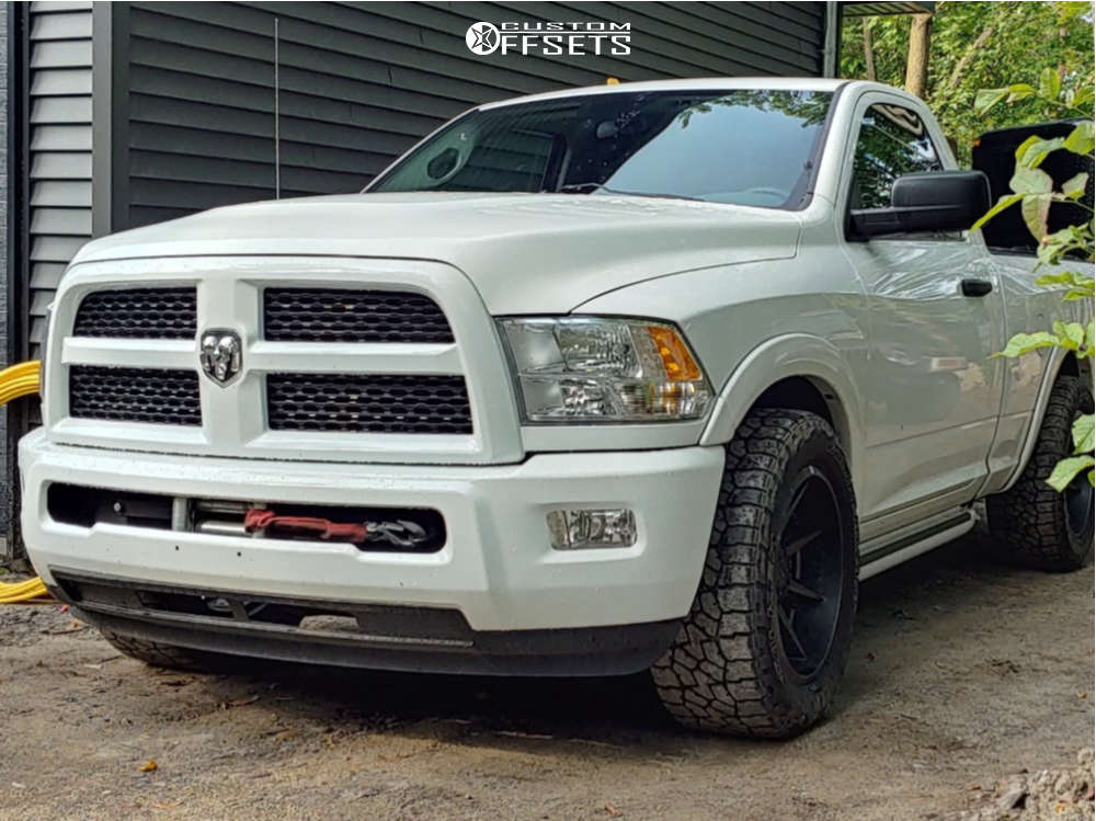 2014 Ram 1500 with 20x10 13 Fast Wheels Grinder and 305/55R20 Falken