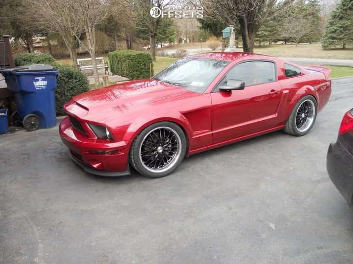 https://images.customwheeloffset.com/web-compressed/1632840-1-2007-mustang-ford-gt-eibach-lowering-springs-mrr-gt1-black.jpg