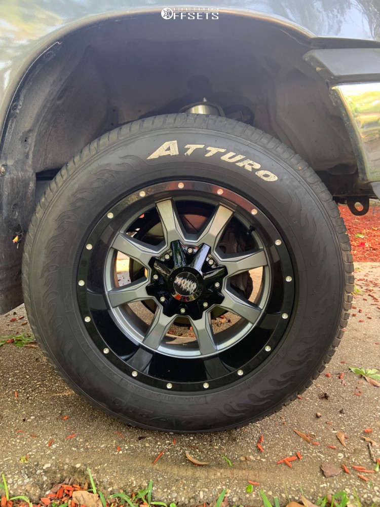 2002 Toyota Tundra with 18x10 -24 Moto Metal Mo970 and 31