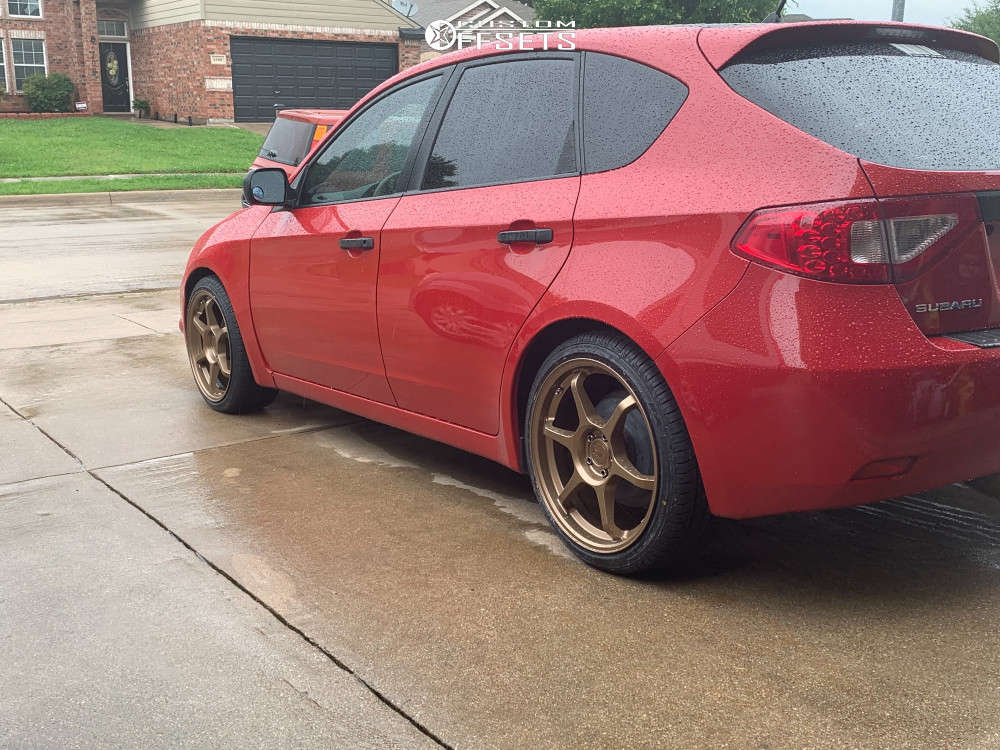 2008 Subaru Impreza with 18x8.5 42 Motegi MR145 and 215