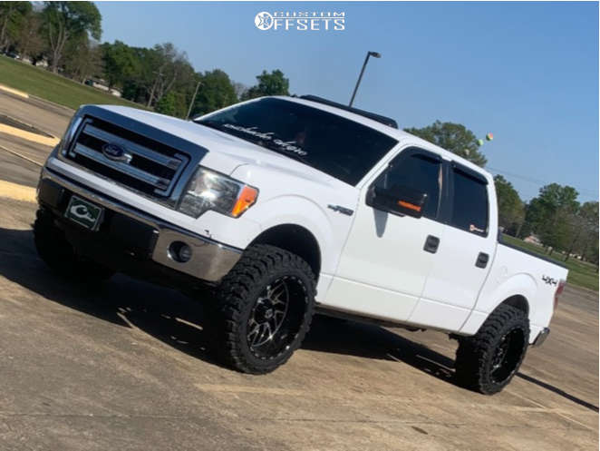 2014 Ford F-150 with 22x12 -43.942 TIS 544BM and 35/12.5R22 Gladiator
