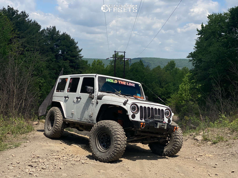 2014 Jeep Wrangler with 17x9 12.7 Trail Master Tm5 and 37/12.5R17 Mickey Thompson Baja Boss MT