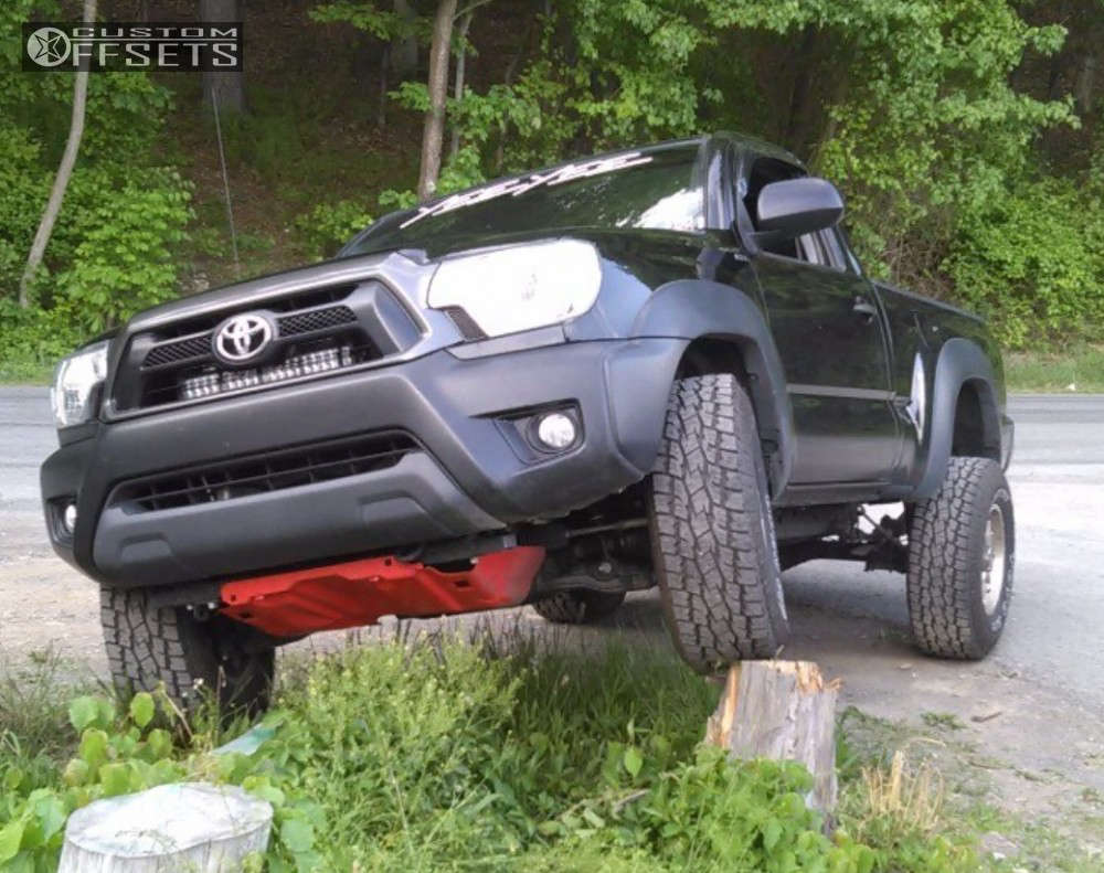 2014 Toyota with 16x8.5 6 Level 8 Guardian and 265/75R16 Toyo