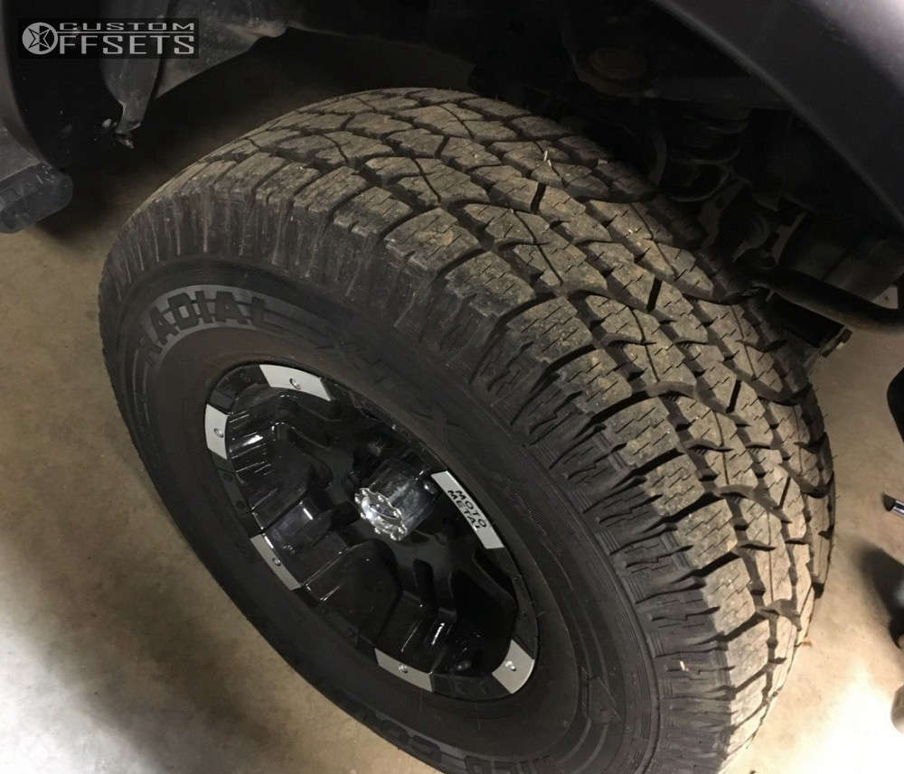 2013 Ram 1500 with 17x9 12 Moto Metal MO951 and 315/70R17 Multi Mile