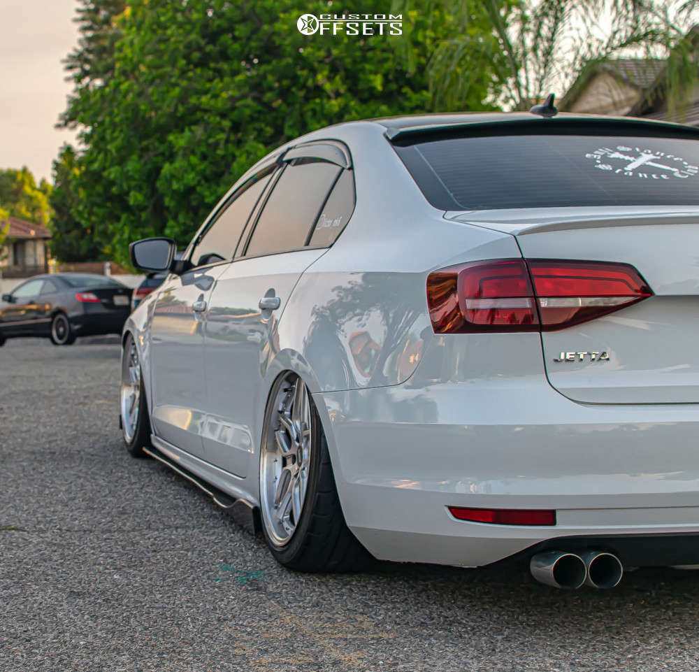 2016 Volkswagen Jetta with 18x8.5 30 ESR Cs15 and 225/40R18 Firestone