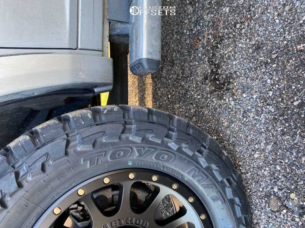 2017 Ram 2500 with 20x9 18 Method Mr305 and 35/12.5R20 Toyo Tires Open