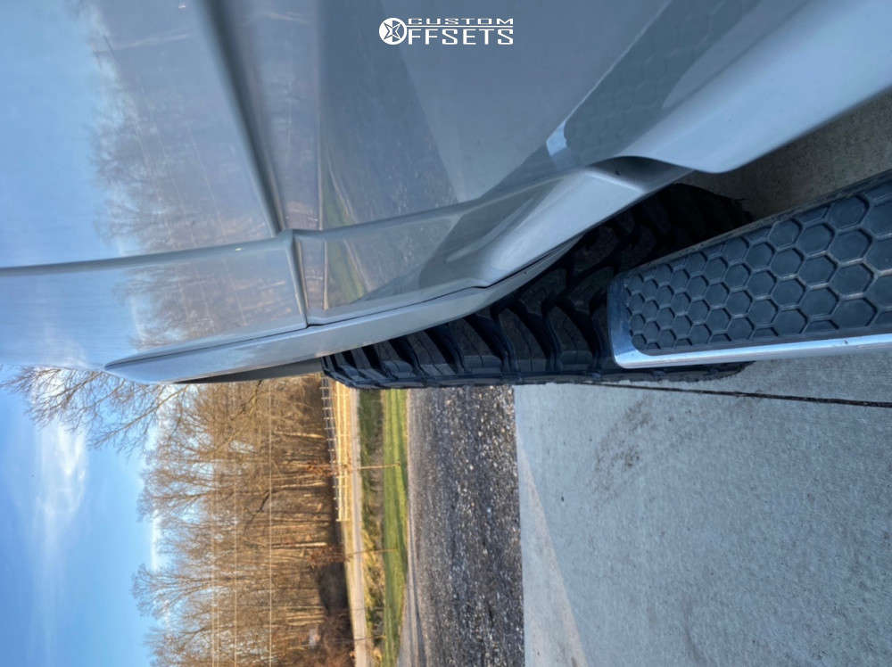 2017 Ram 2500 with 20x9 18 Method Mr305 and 35/12.5R20 Toyo Tires Open