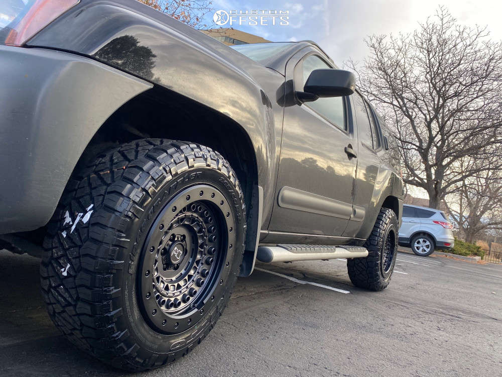 2015 Nissan Xterra with 18x9 10 Black Rhino Barricade and 265/60R18 ...