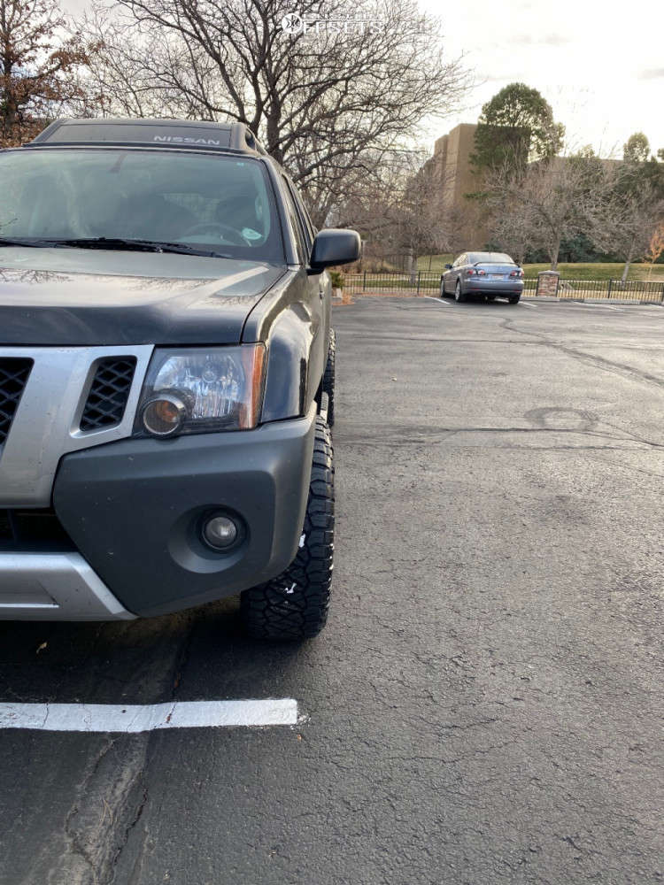 2015 Nissan Xterra with 18x9 10 Black Rhino Barricade and 265/60R18 ...