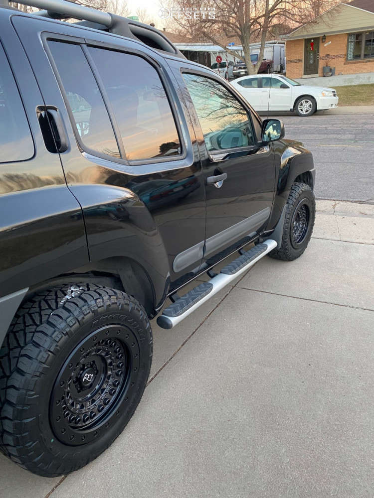 2015 Nissan Xterra with 18x9 10 Black Rhino Barricade and 265/60R18 ...