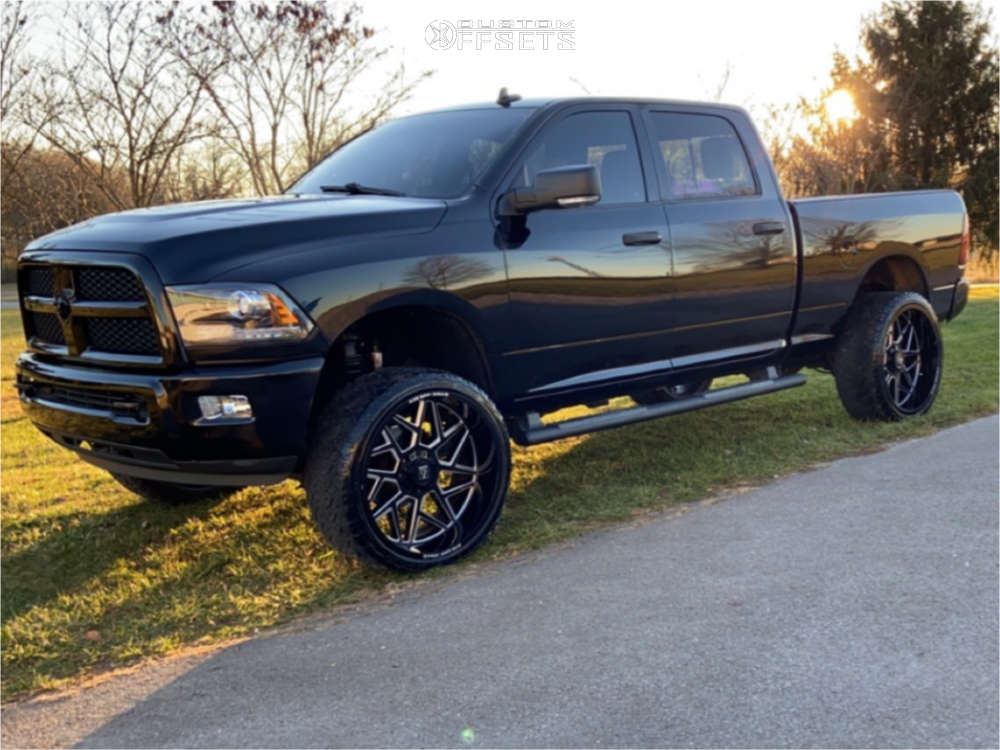 2015 Ram 2500 with 26x12 46 Axe Offroad Nemesis and 35/13.5R26 Venom