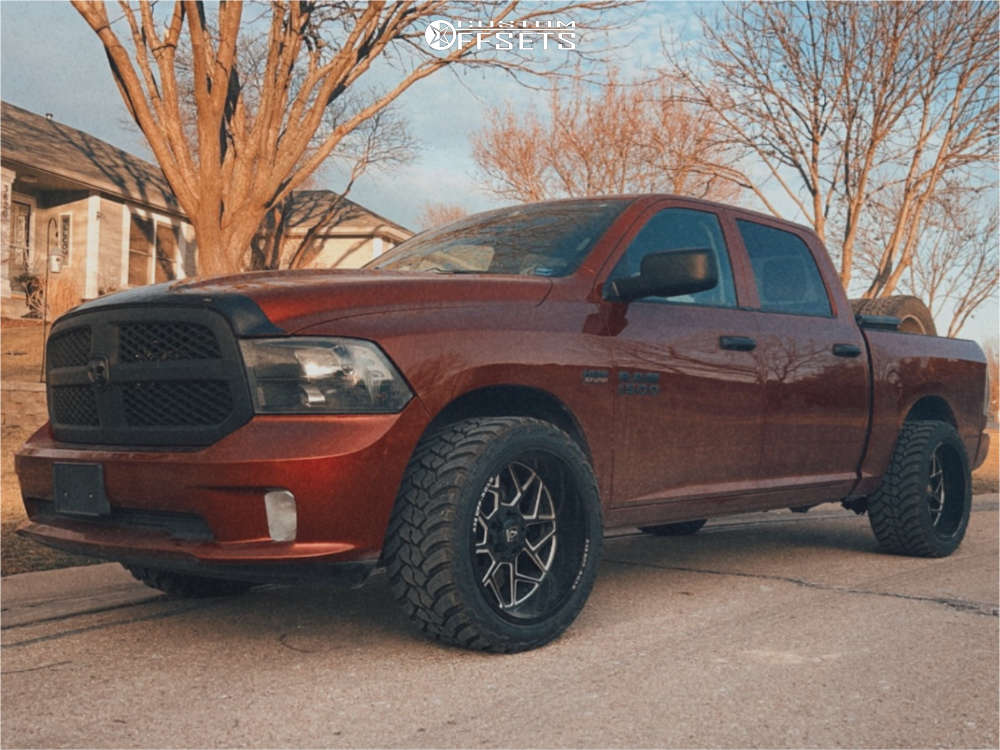 2014 Ram 1500 with 22x12 44 Axe Offroad Nemesis and 33/12.5R22 AMP Mud