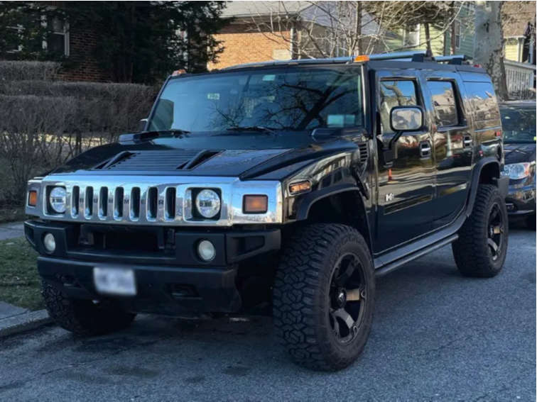 HUMMER 2004 HUMMER H2 with 24x14 -76 American Truxx Vortex and 35/13.5R24