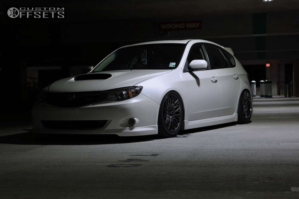 2009 Subaru Impreza with 17x8.5 37 XXR 553 and 235/45R17 Michelin