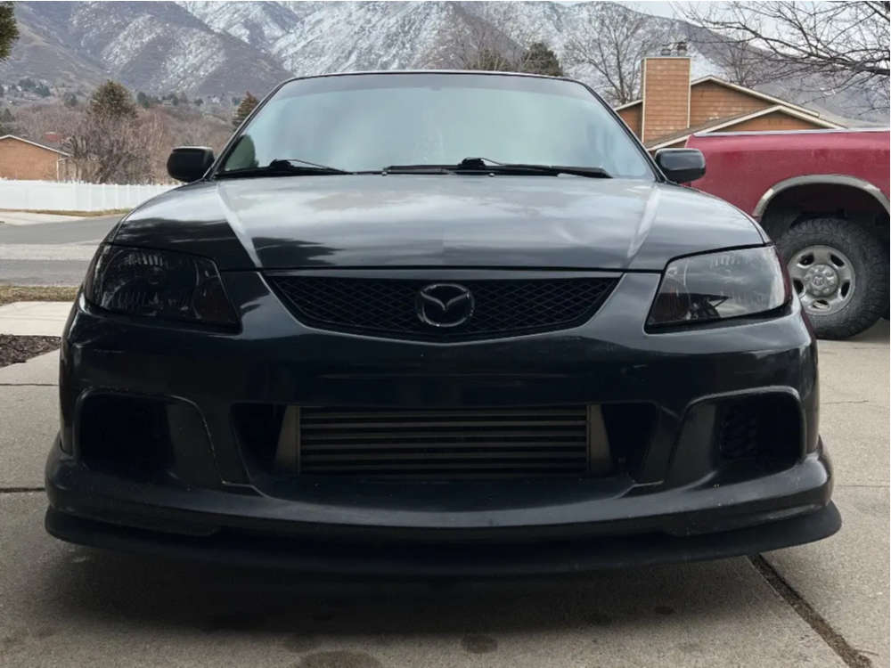 2003 Mazda Protege with 17x8.25 25 XXR 527 and 215/40R17 Nexen