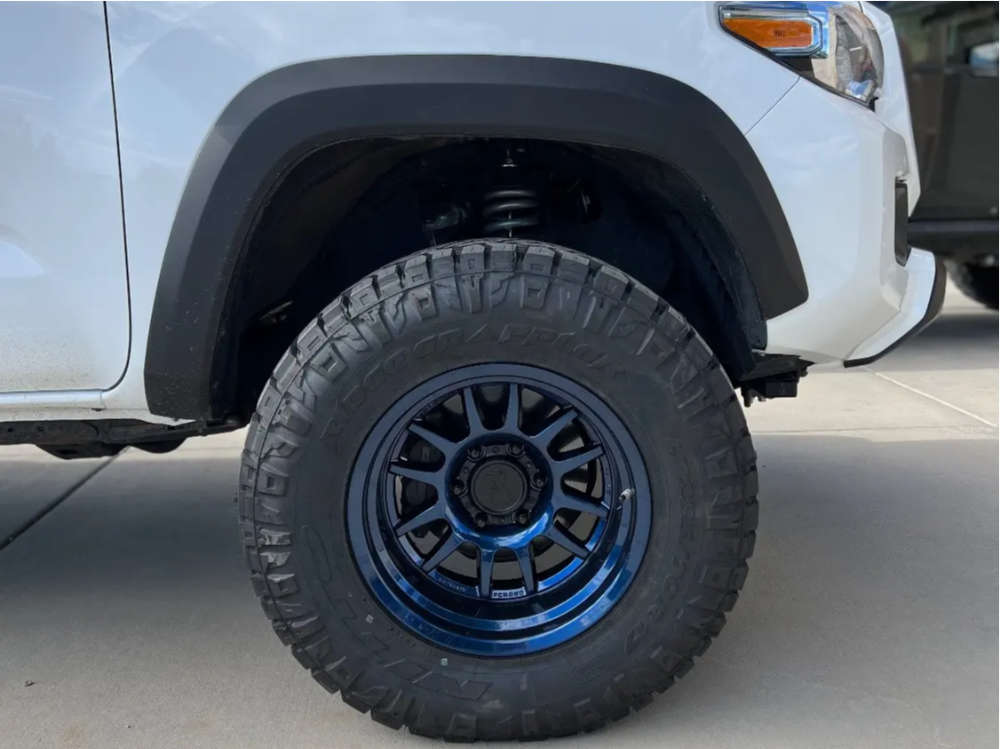 2016 Toyota with 17x9 38 Black Rhino Guide and 285/70R17 Nitto