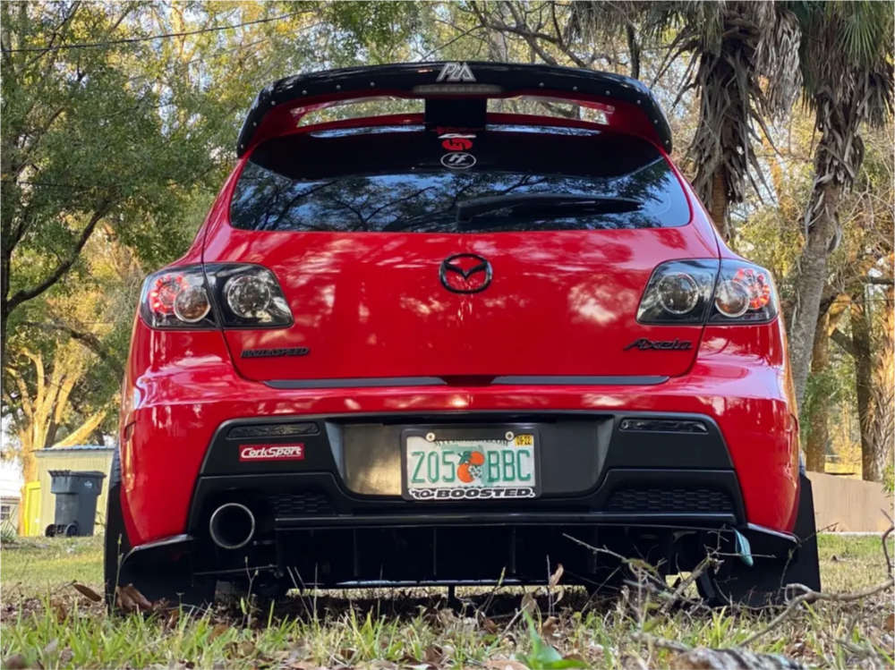 2008 Mazda 3 with 18x8.5 38 Enkei Nt03m and 225/40R18 Firestone