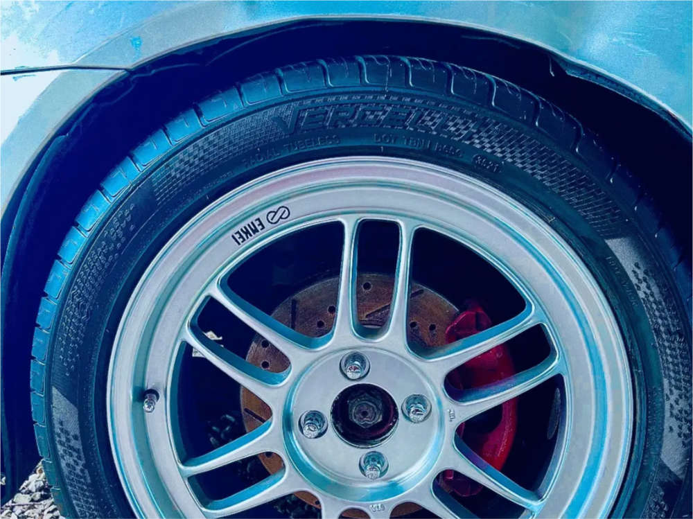2005 Honda Civic with 17x7 43 Enkei Rpf1 and 245/40R17 Vercelli