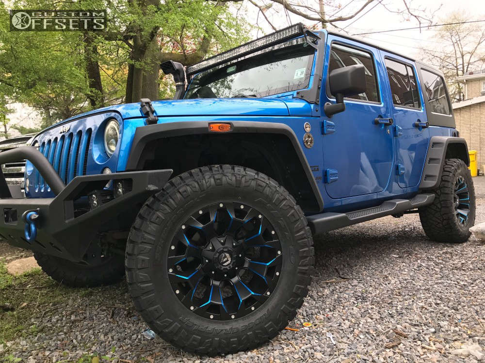 2015 Jeep Wrangler with 18x9 12 Fuel Assault and 33/12.5R18 Nitto