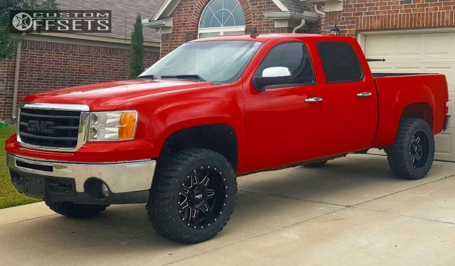 2011 GMC Sierra 1500 with 20x10 24 Moto Metal Mo975 and 33/12.5R20