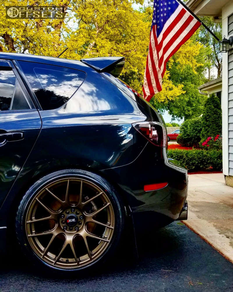 2008 Mazda 3 with 18x8.75 33 XXR 530 and 225/40R18 Continental All