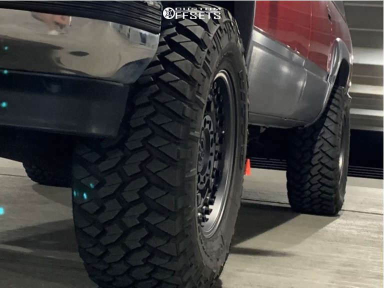 1999 Chevrolet K1500 Suburban with 17x9.5 -18 Black Rhino Armory and 33 ...