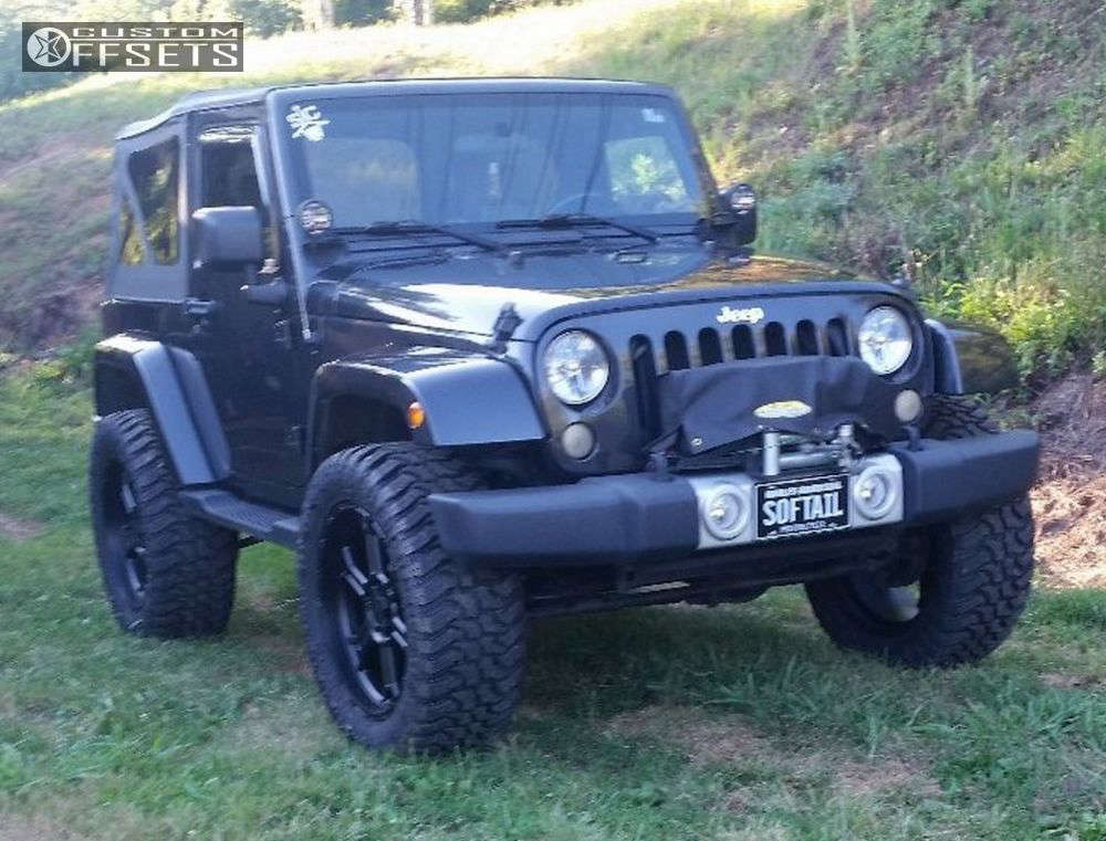 2010 Jeep Wrangler with 22x9.5 12 Vision Raptor and 35/12.5R22 Black