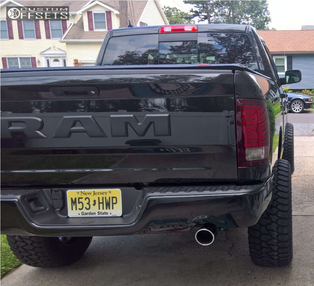 2017 Ram 1500 with 20x10 24 Fuel Hostage and 35/12.5R20 AMP Terrain