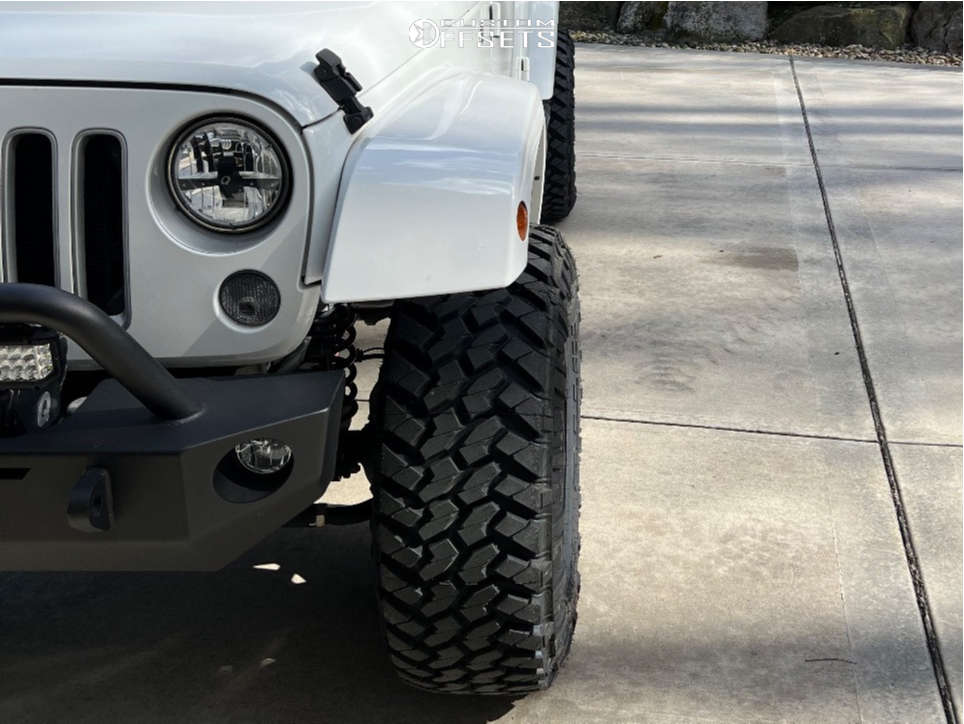 2016 Jeep Wrangler with 17x9 12 Method Mr703 and 35/12.5R17 Nitto